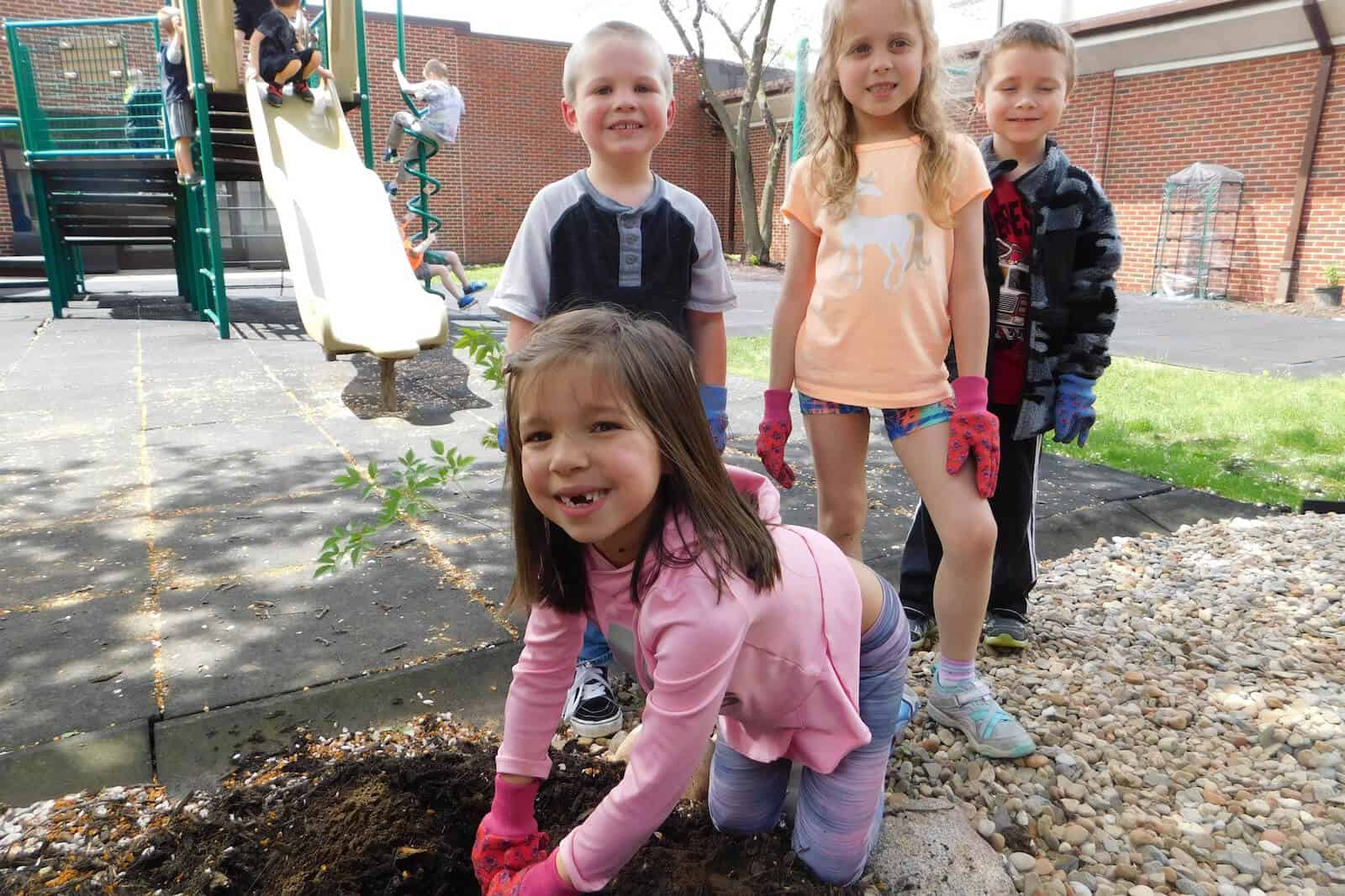 4 students gardening